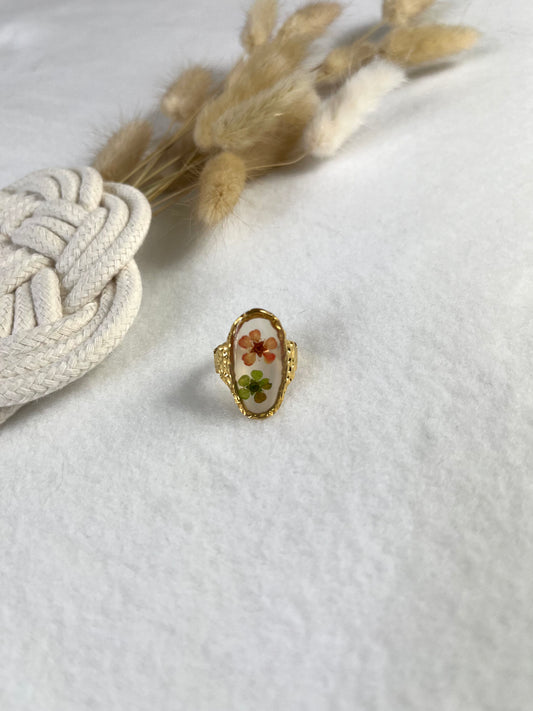 Bague avec deux fleurs séchées en acier inoxydable